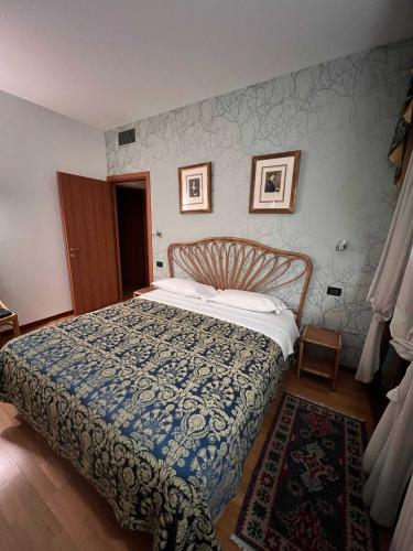 Ένα ή περισσότερα κρεβάτια σε δωμάτιο στο Palazzo Brando - Living Apartments