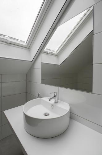 a bathroom with a sink and a mirror at Ponty-Papa Rendezvényház in Dávod