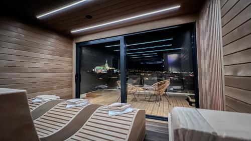 two beds in a room with a view of a patio at BOUTIQUE HOTEL11 with rooftop SPA in Nitra