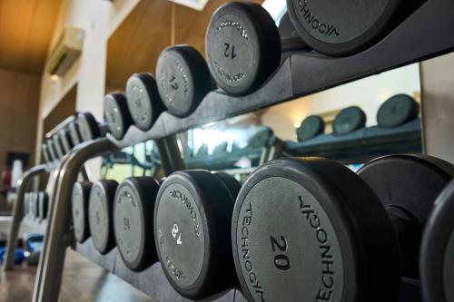 a row of dumbbells on a rack in a gym at Peebles Hydro in Peebles