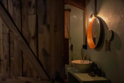 a bathroom with a sink and a mirror at RAICES Casa Rural in Torre de Don Miguel