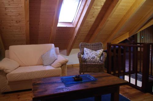 a living room with a couch and a coffee table at Erebia Appartamenti Vacanza in Villadossola