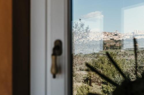a close up of a door with a window at La pagliera in Agrigento