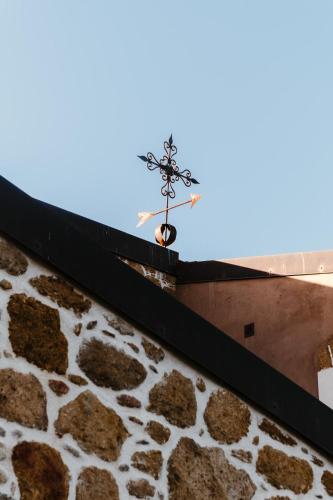 a cross on the roof of a building at La pagliera in Agrigento