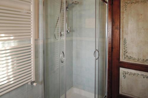 a bathroom with a shower with a glass door at Holiday home Cerbaiola, Lamporecchio in Lamporecchio