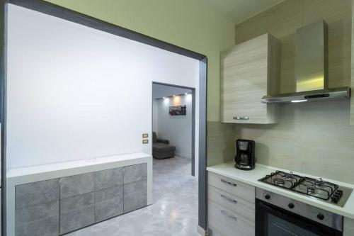 a kitchen with a sink and a stove top oven at Holiday Home Lucifero in Contura