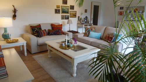 a living room with a couch and a table at Kleines Refugium in Bad Sachsa
