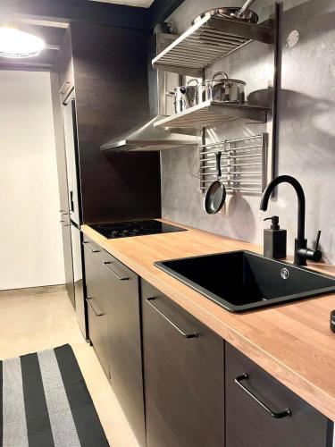 a kitchen with a sink and a counter top at Villa Rio by Valada Village in Valada