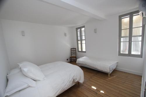Ένα ή περισσότερα κρεβάτια σε δωμάτιο στο Région PACA -Provence Alpes Côte d'Azur - Camargue