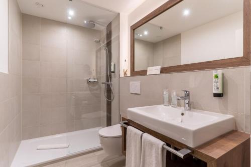 Ein Badezimmer in der Unterkunft Hotel Garni Kölfhamm