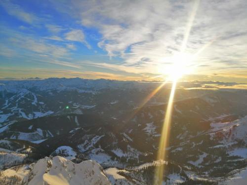an image of the sun setting over the mountains at Haus Schnöller in Bach