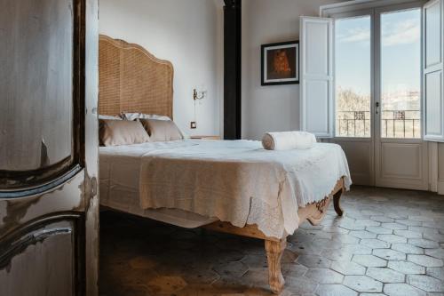 Tempat tidur dalam kamar di La pagliera