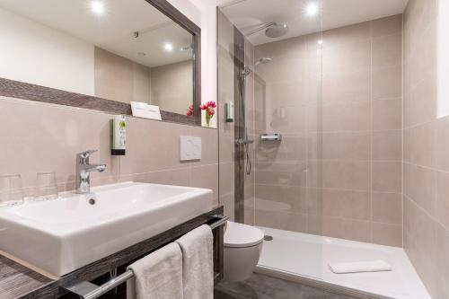 Ein Badezimmer in der Unterkunft Hotel Garni Kölfhamm