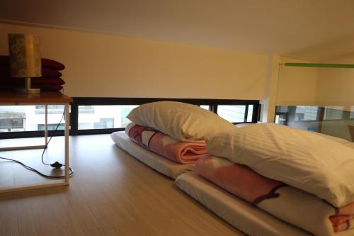 two pillows sitting on the floor in a room at Sky Ocean in Yilan City