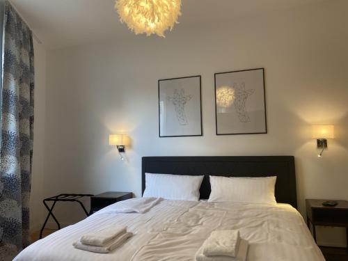Katil atau katil-katil dalam bilik di URBAN STAY Hamburg - Apartments "BACKBORD" & "STEUERBORD mit Sauna"