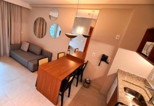 a living room with a table and a couch at Salinas Exclusive Resort in Salinópolis