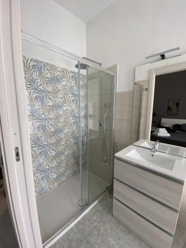 a bathroom with a shower and a sink at AMARIS in Tortolì
