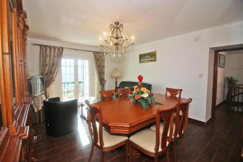 a dining room with a table and chairs at Eira Costa House by Gerês Casas in Geres
