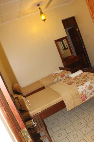a bedroom with a large bed in a room at Safina Resort in Zanzibar City