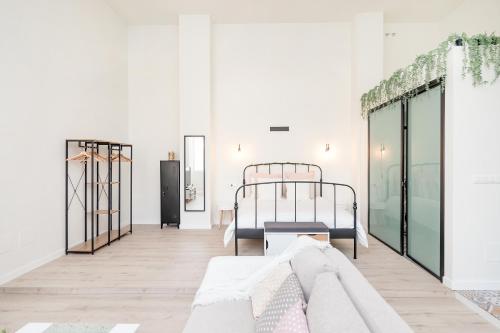 Posteľ alebo postele v izbe v ubytovaní BHost - Loft El Angel