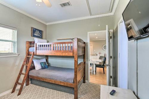 a bedroom with two bunk beds in a room at Walk to Ocean Pura Vida Crystal Beach House! in Crystal Beach