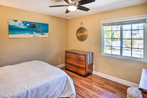 a bedroom with a bed and a window at Deluxe Laguna Hills Home with Outdoor Oasis! in Laguna Hills