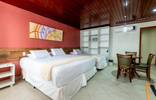 Katil atau katil-katil dalam bilik di Serra Golfe Apart Hotel
