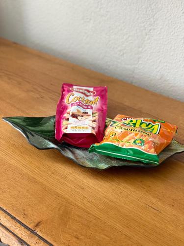two bags of food sitting on a table at Diamond rock in Le Diamant