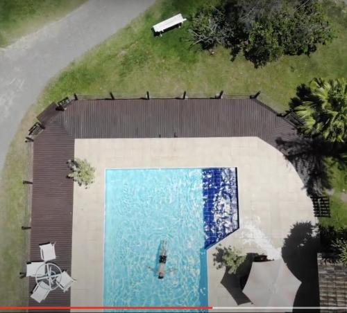 an overhead view of a swimming pool on a house at Haute Haus - Guest House in Florianópolis