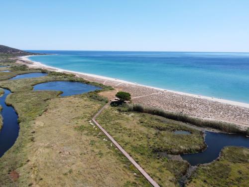 an aerial view of the shoreline of the ocean at Casa Angelina-Ammentos Posada in Posada
