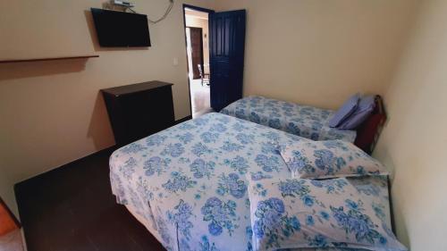 Tempat tidur dalam kamar di Solar Oliveira