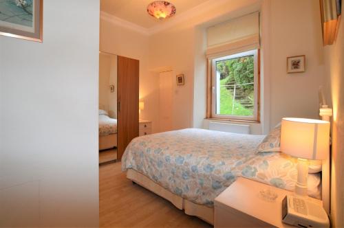 Llit o llits en una habitació de Kames View Apartment