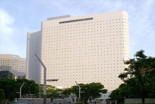 a large white building with a lot of windows at Shinjuku Washington Hotel in Tokyo