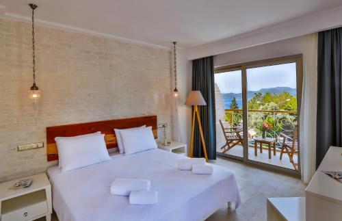 Postel nebo postele na pokoji v ubytování Arnna Hotel