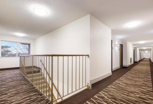 an empty hallway with a staircase in a house at Red Roof Inn Lawrenceburg in Lawrenceburg