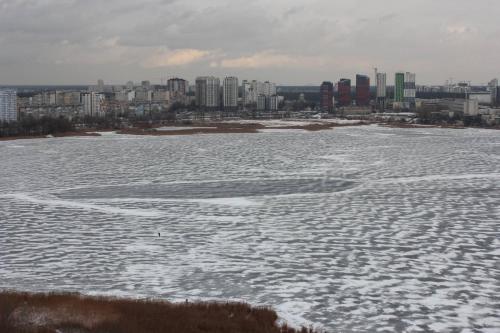 a large body of water with a city in the background at Revutskogo 54 метро Харьковская, Позняки, Квартира з видом на озеро in Kyiv