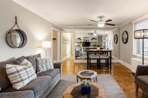 a living room with a couch and a table at Rare 2 Bed 2 Bath Downtown Condo Near Aquarium in Atlanta