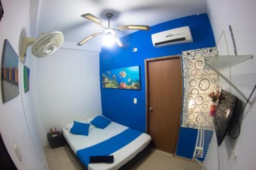 Postel nebo postele na pokoji v ubytování Hotel Taganga Santa Marta