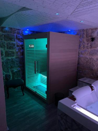 a room with a bedroom with a window with blue lights at Caveau in Palermo