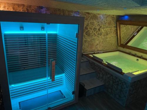 a large bathroom with a tub and a swimming pool at Caveau in Palermo