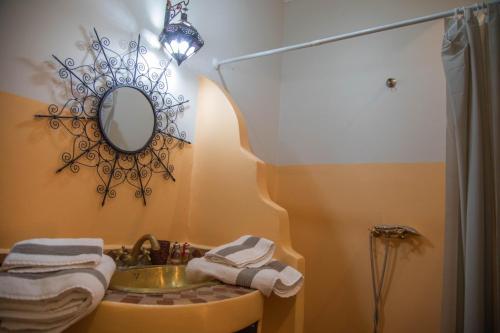 a bathroom with a sink and a mirror at New Bahia in Marrakech