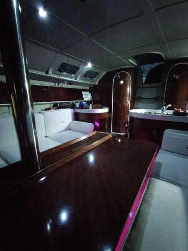 an inside view of a bus with a table and chairs at Yatch Barracuda Douro Marina Boat Sleep Experience in Vila Nova de Gaia