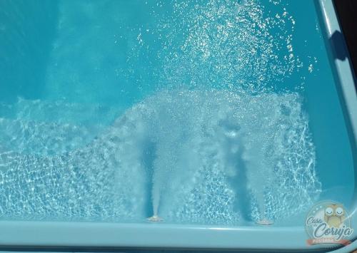 a person is in a pool of water at Casa da Coruja in Rio de Janeiro