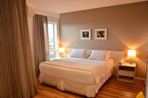 Postel nebo postele na pokoji v ubytování Unico Apart Hotel
