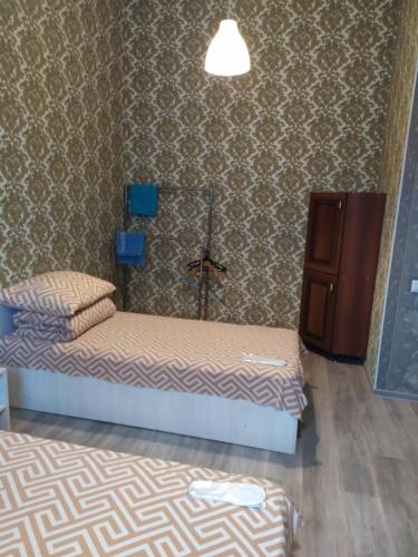 Ένα ή περισσότερα κρεβάτια σε δωμάτιο στο Mini Hotel na Gasheka