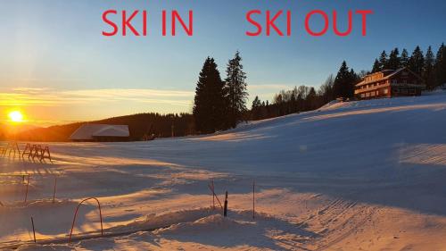 a snow covered hill with the words ski in six out at Residenz Grafenmatt Feldberg in Feldberg