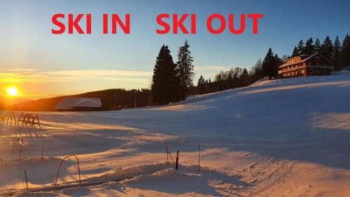 a snow covered hill with the words ski in six out at Residenz Grafenmatt Feldberg in Feldberg