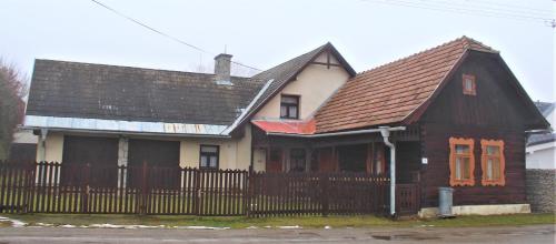 a house with a fence in front of it at Vila Líška in Pavčina Lehota
