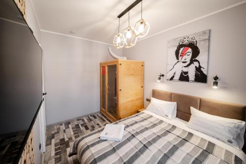 Ένα ή περισσότερα κρεβάτια σε δωμάτιο στο APARTAMENT MODERN
