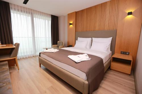 Ein Bett oder Betten in einem Zimmer der Unterkunft Pikola Otel